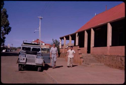 Two people standing outside a hotel in Kuruman