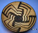 Basketry tray, coiled. Geometric designs.