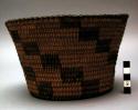 Small basket with black checkered designs.