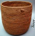 Utility basket, coiled. Made of bear grass (natural and dyed red, brown).