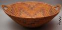 Large basket tray with 2 handles. Coil construction. Made of bear grass.