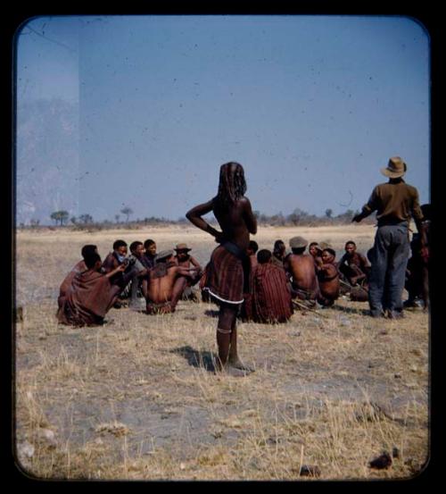 Group of people sitting and standing