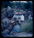 Boat next to rocky shore of the Kavango River