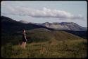 Elizabeth Marshall Thomas standing, hills in the background