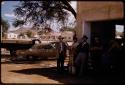 Group of people standing in a garage