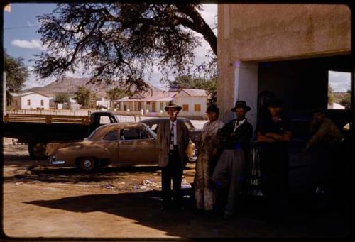 Group of people standing in a garage