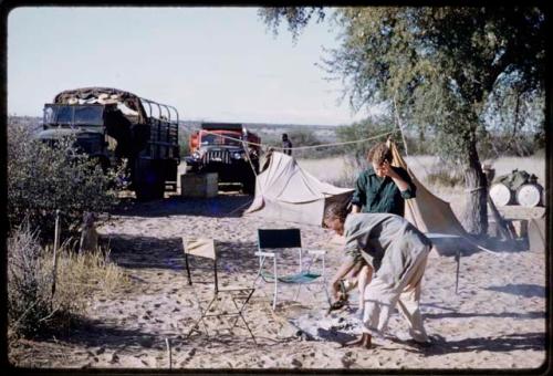 /Gishay making a fire, with Elizabeth Marshall Thomas watching him