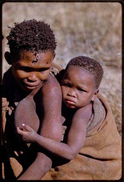 Woman carrying a baby on her back