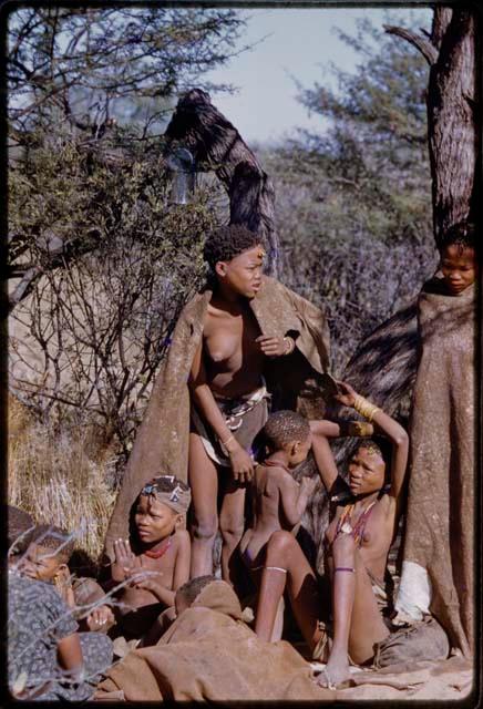 Group of women and children sitting at the Marshall Expedition camp