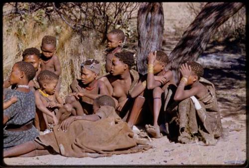 Group of women and children sitting at the Marshall Expedition camp