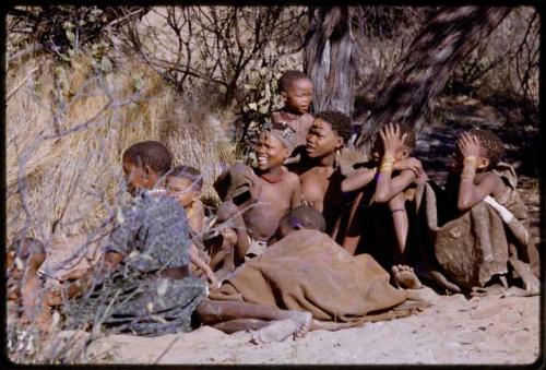 Group of women and children sitting at the Marshall Expedition camp