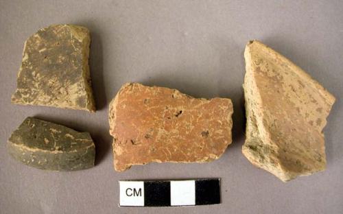 2 rim potsherds; 2 potsherds - hand-made, early looking glaze, well baked