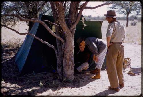 L. F. Maingard and Daniel Blitz by a tent