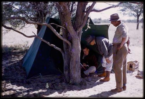 L. F. Maingard and Daniel Blitz in a tent, recording interviews and showing Wilhelm Camm