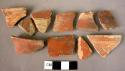 5 rim potsherds; 5 sherds; 1 handle fragment; 1 base fragment - red glazed ware