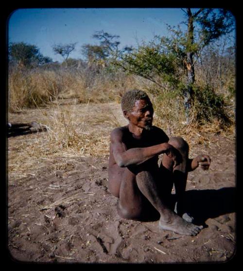 Portraits: "Old Demi" sitting on the ground