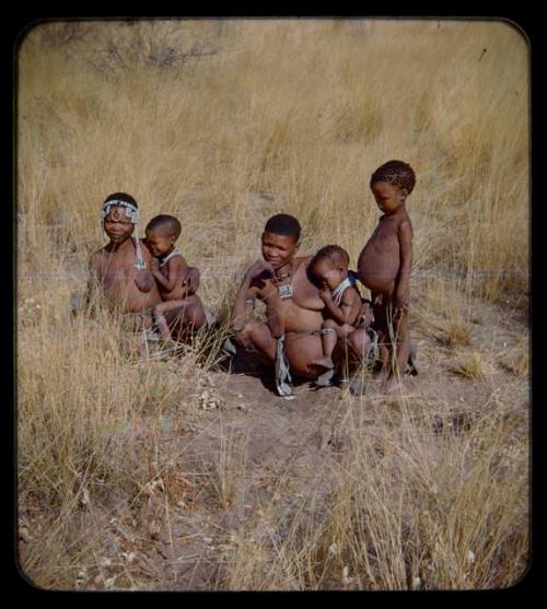 Portraits: Two women sitting with children