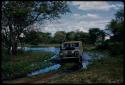 Pan filled after rain, with a truck in a rain-filled track