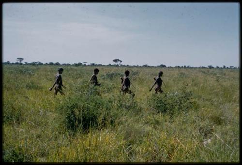 Four young men going hunting in single file