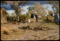 Group of people gathered near a cookhouse