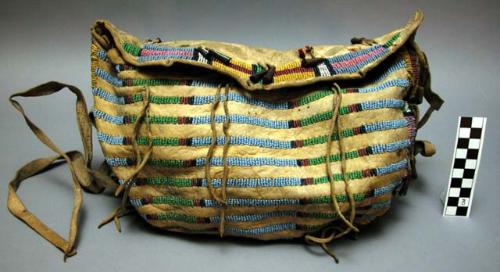 Glass-beaded deerskin shoulder bag with metal tinklers