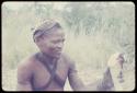 Man from Samangaigai making an axe