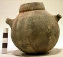 Small pottery vessel with miniature handles and white linear design