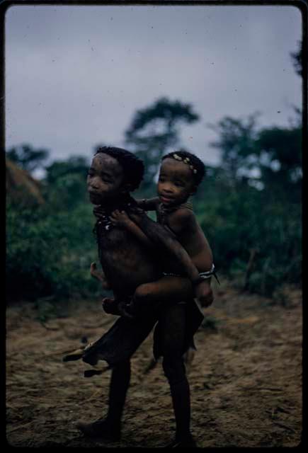 Child carrying another child