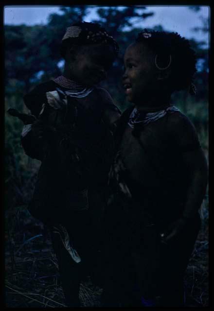 Two girls playing; one is the daughter of Hxua//a (one of Gaou's wives)