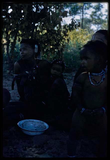 Group of women and children sitting