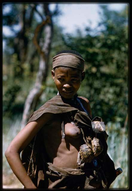 Woman with a skin draped over her shoulder