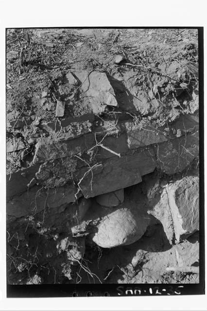 Pot in situ beneath wall of lowest terrace, Mound 12