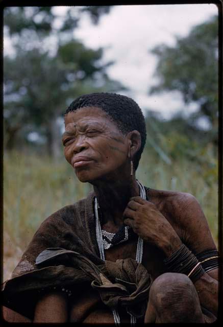 Woman from Samangaigai group sitting