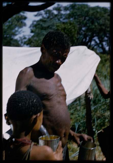 Gau showing //Kushay water, with canvas shown in the background