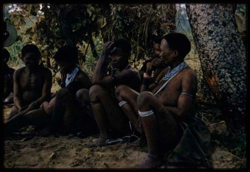 John Marshall (not shown) filming a group of people in rainy season