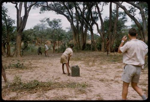 Group of people playing a cricket game