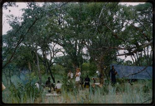 Expedition members (including John Marshall) at the camp kitchen from a distance