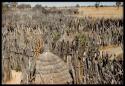 People, round huts and fence inside a kraal, view from the top of the expedition truck