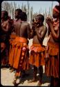 Wives of Chief Nehemiah standing in a line, singing and clapping