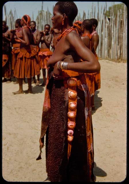 Head wife of Chief Nehemiah standing, profile