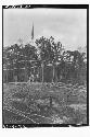 Men putting up masts for tijeras