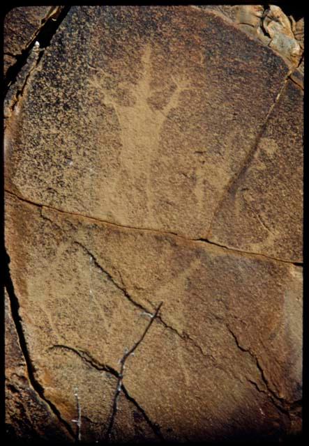 Petroglyph of human figure at Scho-Scho, with four fingers on one hand and five on the other, close-up