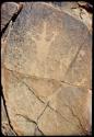 Petroglyph of human figure at Scho-Scho, with four fingers on one hand and five on the other, close-up