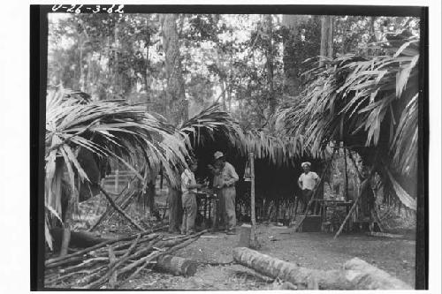 Men eating at workmen's camp