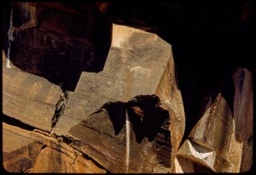 Petroglyphs of three human feet and a rhino at Scho-Scho