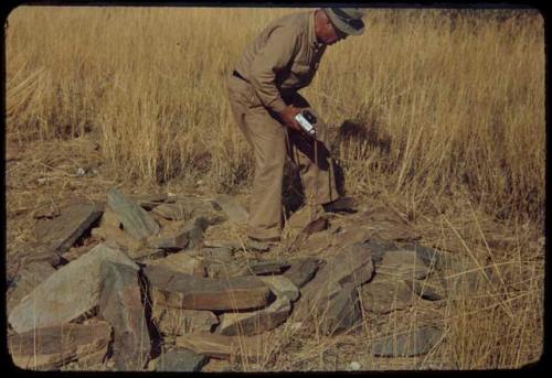 Merl La Voy examining dwelling site at Scho-Scho