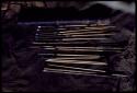 Arrow: Quiver, arrows, gum stick, two drills, two awls, two other sticks and two firesticks, close-up