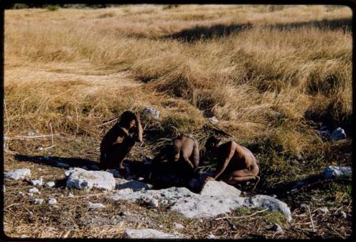 Bathing: Two young men drinking at a waterhole near Deboragu