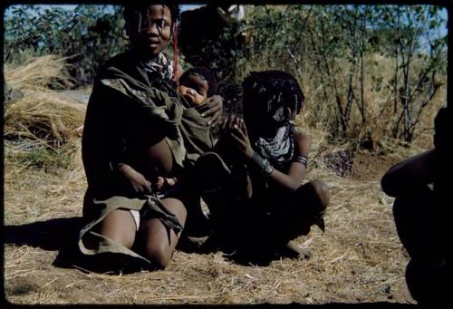 Children, Carrying: Girls playing with a baby, including ≠Gisa (daughter of //Gao and Khwo//o-/Gasa) who is crouching