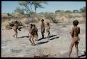 Children, Groups, play: Group of boys and girls playing near a waterhole